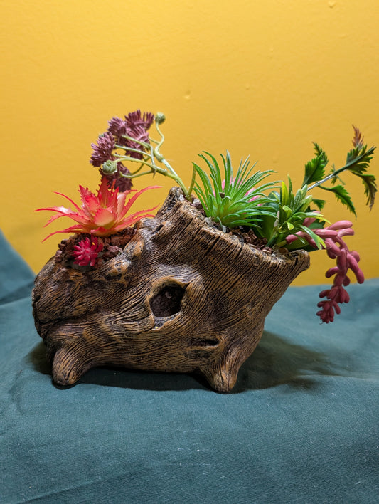Log with Faux Plants